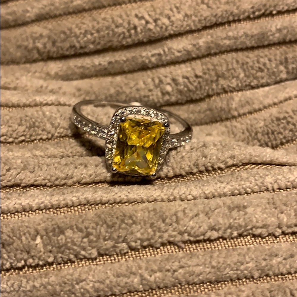 Yellow canary like ring with diamond halo sides 7